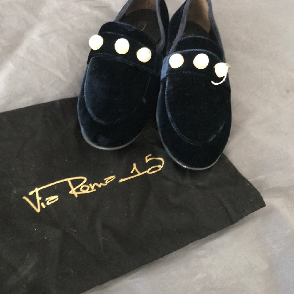 Designer navy velvet loafer with pearl detail.